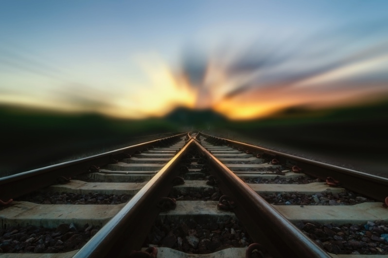 Railroad tracks at sunset symbolizing a strategic path forward for OBBBA charitable deduction planning.